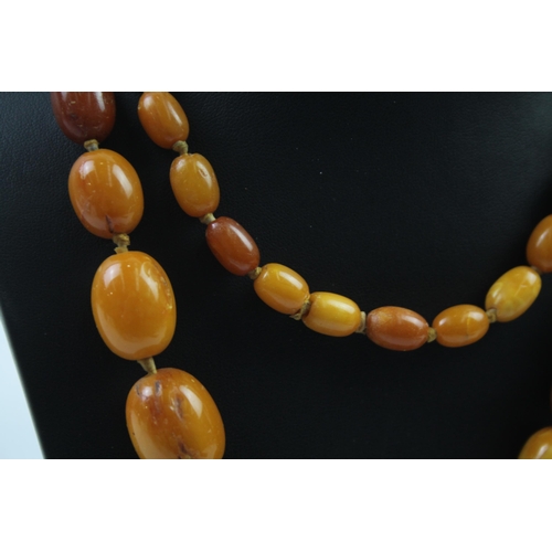 165 - Antique Amber graduated necklace individually knotted (66g)