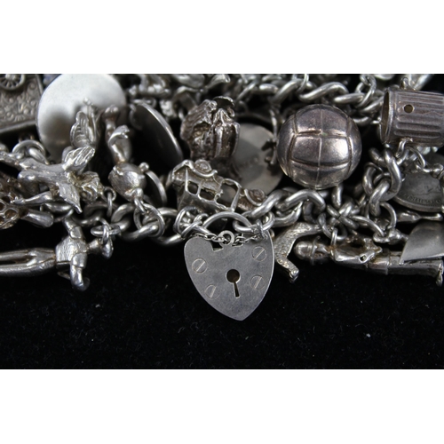 176 - Silver charm bracelet including emergency money charm (110g)