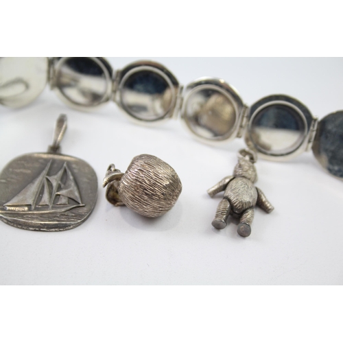 182 - A collection of silver pendants including teddy bear (68g)