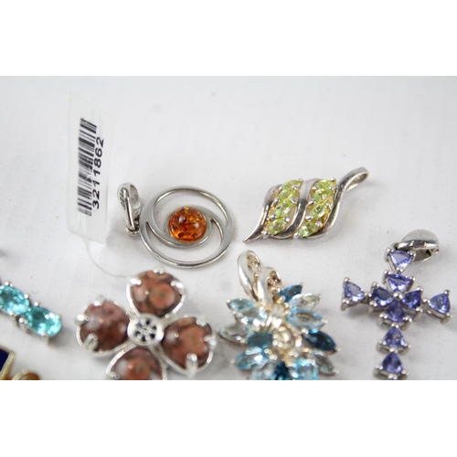 187 - A collection of silver gemstone pendants including Amber (26g)