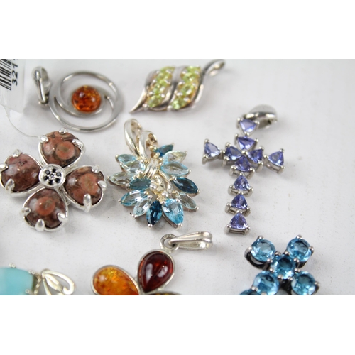 187 - A collection of silver gemstone pendants including Amber (26g)