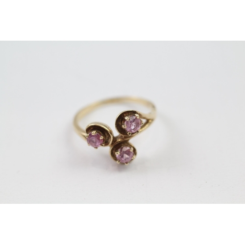 2 - 9ct gold synthetic pink sapphire three stone ring (2.9g) Size  M+1/2