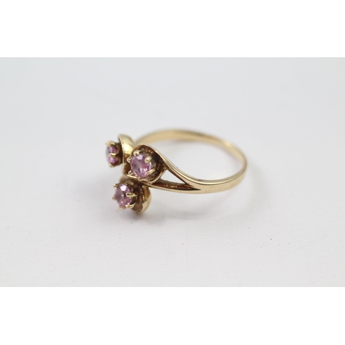 2 - 9ct gold synthetic pink sapphire three stone ring (2.9g) Size  M+1/2