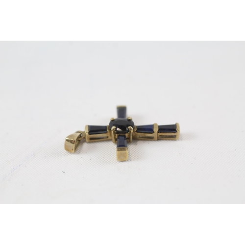 37 - 9ct gold sapphire cross pendant (1.4g)