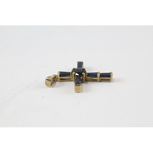 37 - 9ct gold sapphire cross pendant (1.4g)