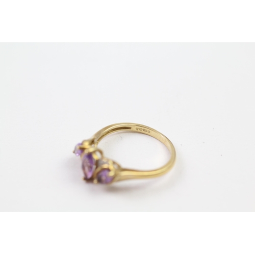 45 - 9ct gold amethyst three stone ring with diamond accent (2.7g) Size  P+1/2