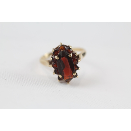 48 - 9ct gold garnet oval cluster ring (3.3g) Size  P