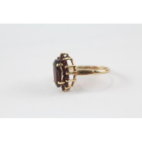 48 - 9ct gold garnet oval cluster ring (3.3g) Size  P