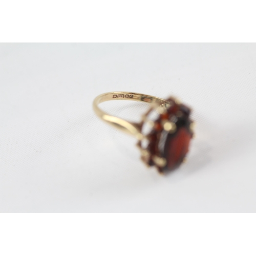 48 - 9ct gold garnet oval cluster ring (3.3g) Size  P