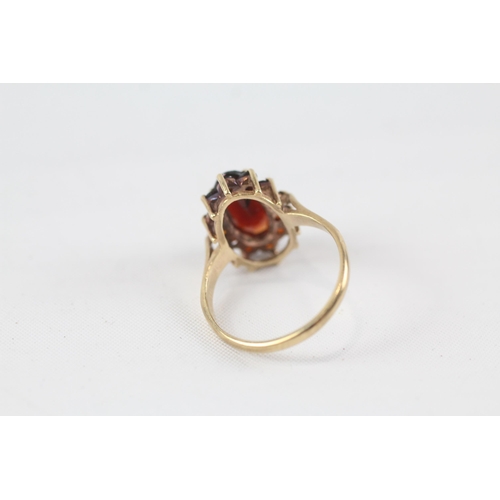 48 - 9ct gold garnet oval cluster ring (3.3g) Size  P