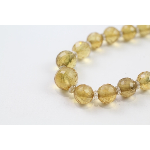 51 - 9ct gold clasp hand faceted citrine & rock crystal graduated single strand necklace (42.6g)