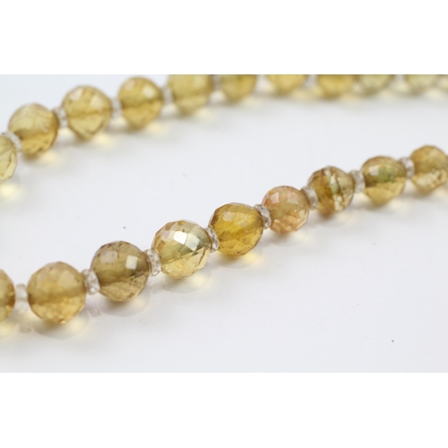 51 - 9ct gold clasp hand faceted citrine & rock crystal graduated single strand necklace (42.6g)