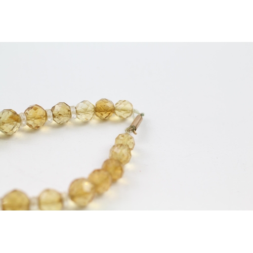 51 - 9ct gold clasp hand faceted citrine & rock crystal graduated single strand necklace (42.6g)