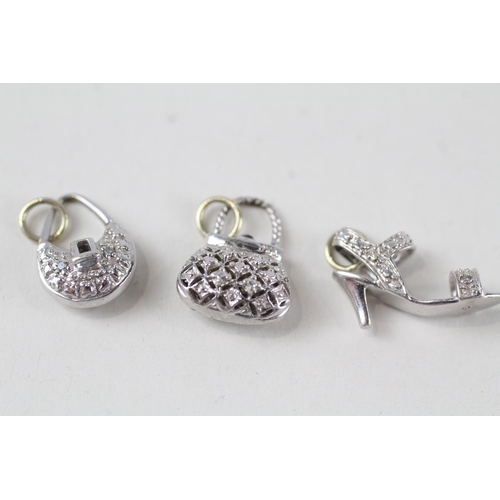 54 - 3 x 9ct white gold diamond charms inc. purse & shoes (3.5g)