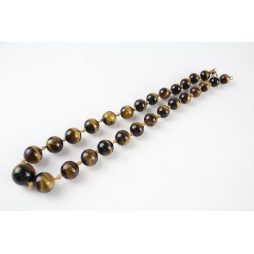 70 - 9ct gold tigers eye bead necklace (68g)