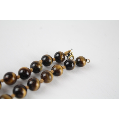 70 - 9ct gold tigers eye bead necklace (68g)