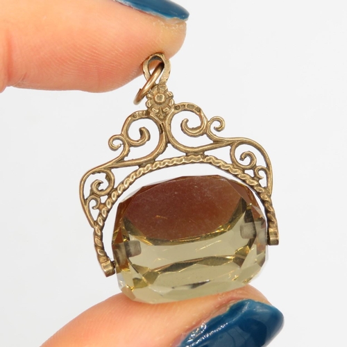 91 - 9ct gold vintage citrine set spinning fob (7g)