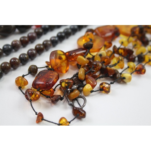 181 - A collection of silver clasped gemstone necklaces including amber (329g)