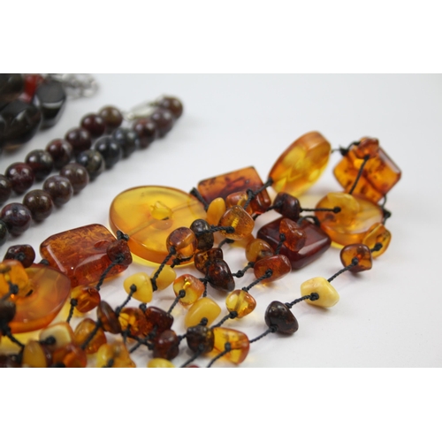 181 - A collection of silver clasped gemstone necklaces including amber (329g)