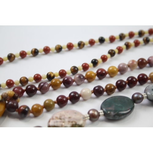 181 - A collection of silver clasped gemstone necklaces including amber (329g)