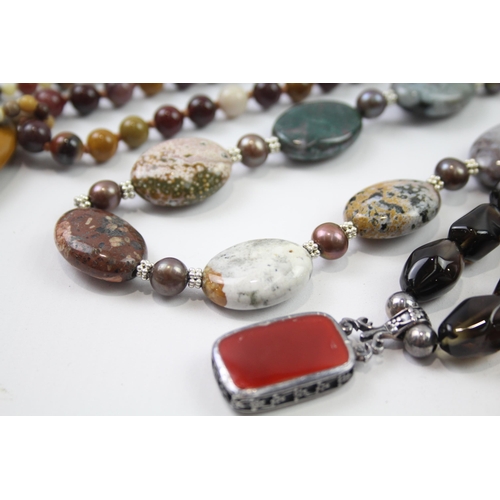 181 - A collection of silver clasped gemstone necklaces including amber (329g)