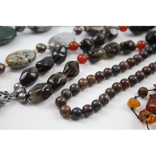 181 - A collection of silver clasped gemstone necklaces including amber (329g)