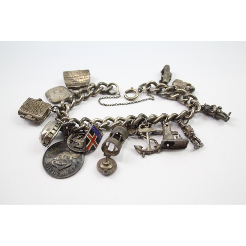 196 - Vintage sterling silver charm bracelet packed with charms (78g)