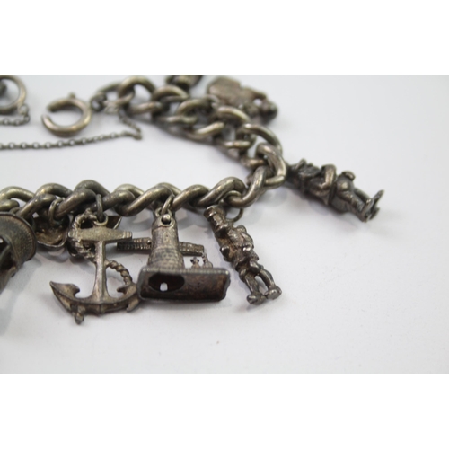 196 - Vintage sterling silver charm bracelet packed with charms (78g)