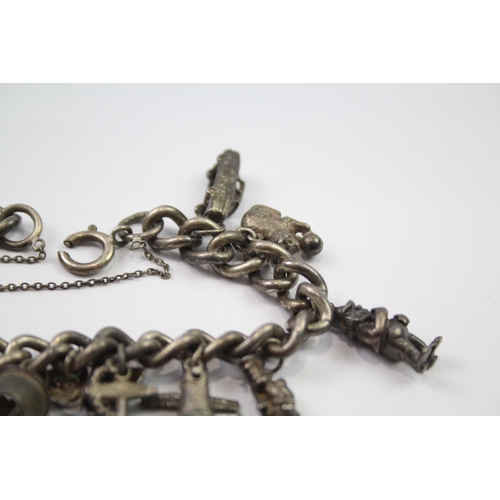 196 - Vintage sterling silver charm bracelet packed with charms (78g)