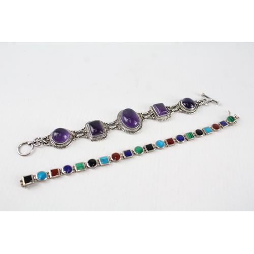 201 - Two sterling silver gemstone bracelets including amethyst, lapis lazuli (65g)