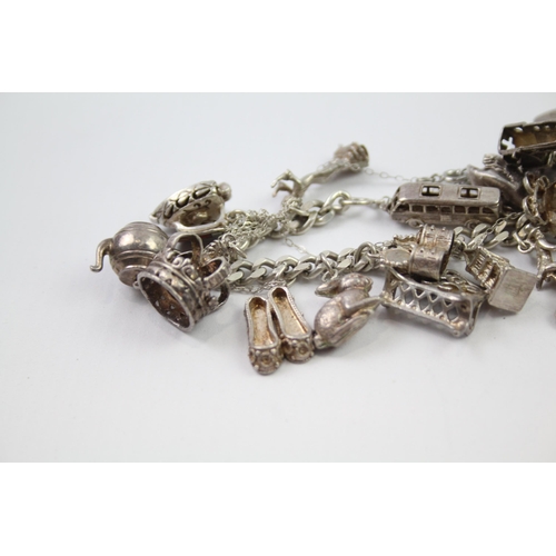 209 - Vintage sterling silver charm bracelet packed with charms (109g)