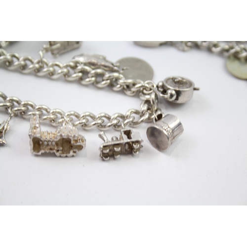 230 - Vintage sterling silver charm bracelet packed with charms (88g)