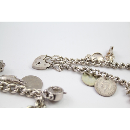 230 - Vintage sterling silver charm bracelet packed with charms (88g)