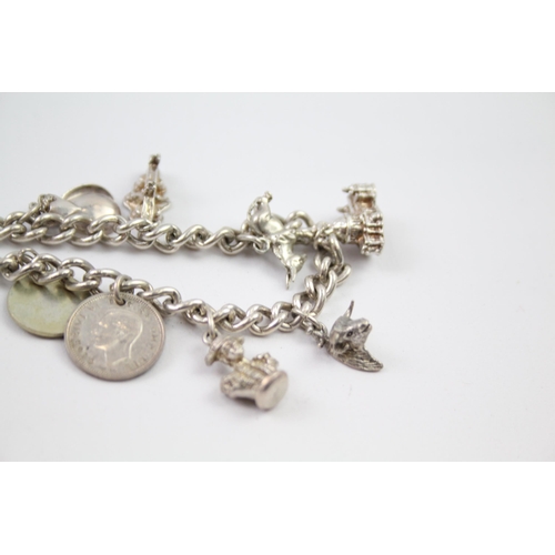 230 - Vintage sterling silver charm bracelet packed with charms (88g)