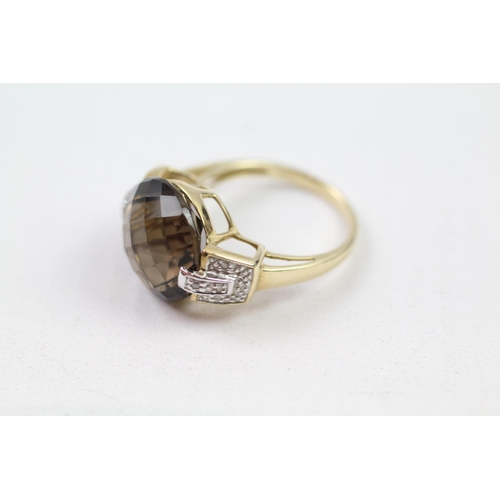 142 - 9ct gold faceted smokey quartz & diamond dress ring (5.1g) Size  O