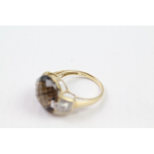 142 - 9ct gold faceted smokey quartz & diamond dress ring (5.1g) Size  O