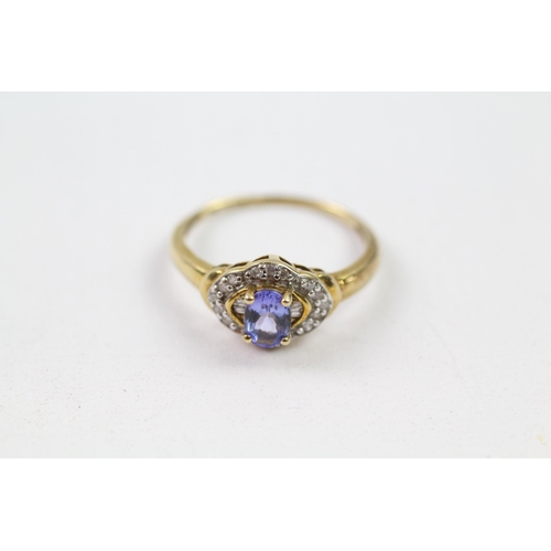 147 - 9ct gold tanzanite & diamond halo ring (2.1g) Size  O 1/2