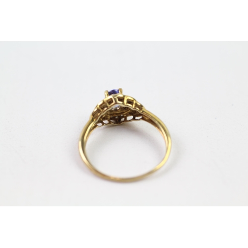 147 - 9ct gold tanzanite & diamond halo ring (2.1g) Size  O 1/2