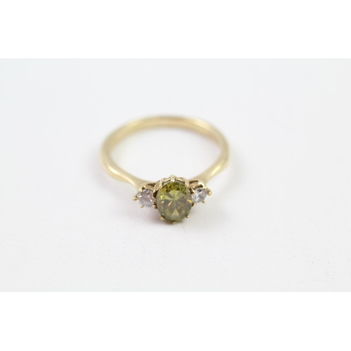 157 - 9ct gold green & white CZ three stone ring (3.6g) Size  T