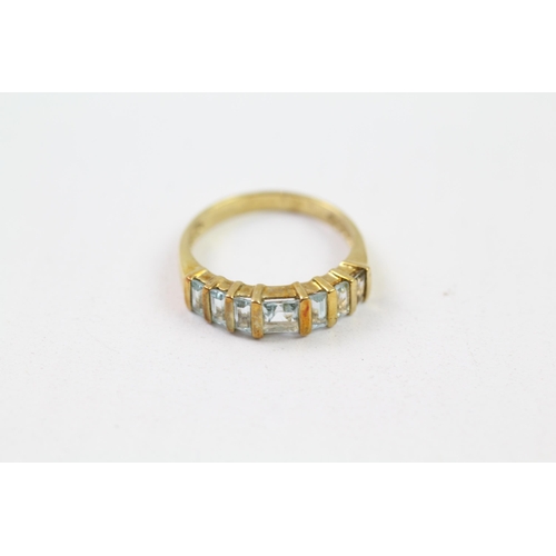 58 - 9ct gold blue topaz half eternity ring (2.5g) Size  N