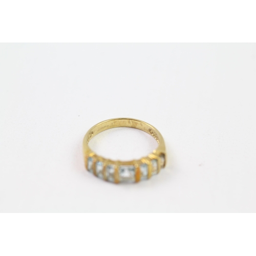 58 - 9ct gold blue topaz half eternity ring (2.5g) Size  N