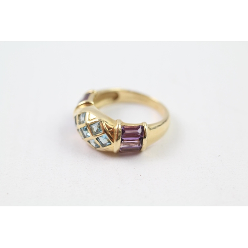 62 - 14ct gold blue topaz & amethyst dress ring (4.3g) Size  M