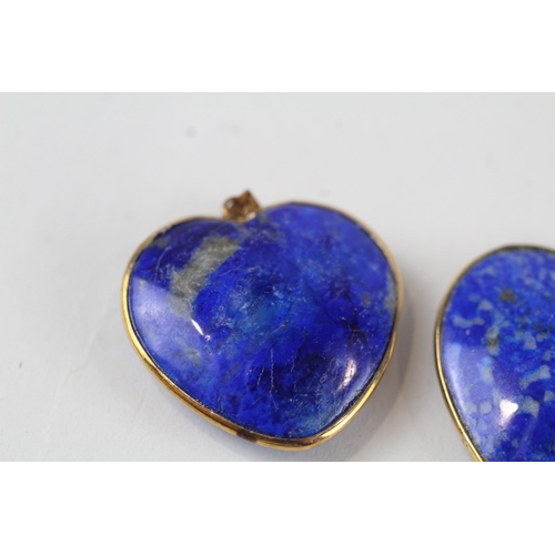 69 - 2x 9ct gold heart shaped lapis pendants (12.6g)