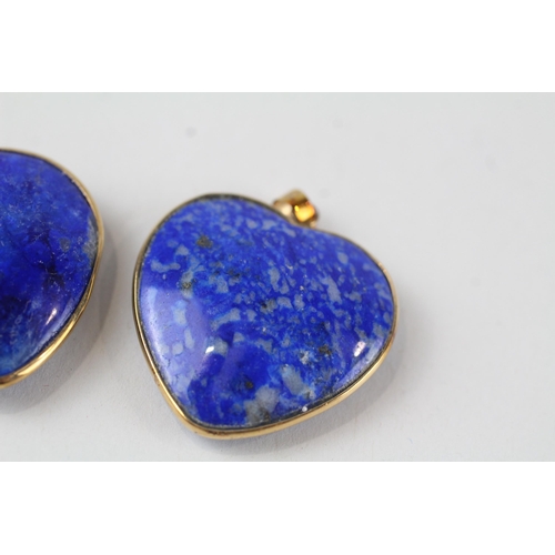 69 - 2x 9ct gold heart shaped lapis pendants (12.6g)