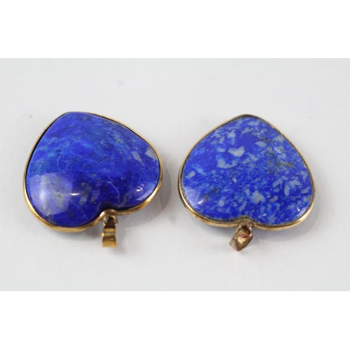 69 - 2x 9ct gold heart shaped lapis pendants (12.6g)