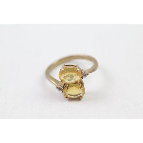 76 - 9ct gold white & yellow gemstone crossover ring (3.2g) Size  N