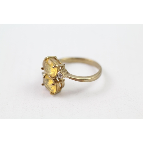 76 - 9ct gold white & yellow gemstone crossover ring (3.2g) Size  N