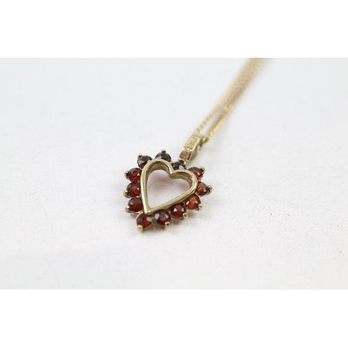 83 - 9ct gold garnet heart pendant & chain (2.9g)