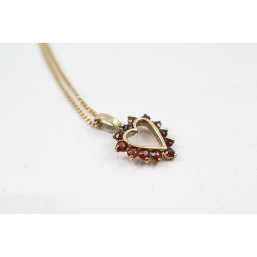 83 - 9ct gold garnet heart pendant & chain (2.9g)