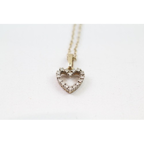 85 - 9ct gold diamond heart pendant & chain (1.9g)